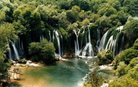 While the sun shines over the waterfalls is always a rainbow. At night in moon light the stream of water looks like silver. The Kravica waterfalls literally spells tourists