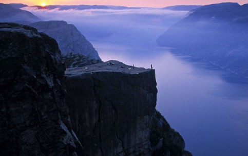 A stunning view from Preikestolen - a giant cliff (604 m) above the Lisefjord can enjoy only the most brave, those who dare to come to its very edge